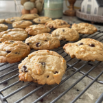 homemade chocolate chip cookies up close on cooling rack