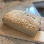 loaf of bread on cutting board