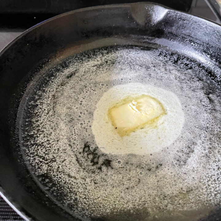 butter melted in cast iron pan